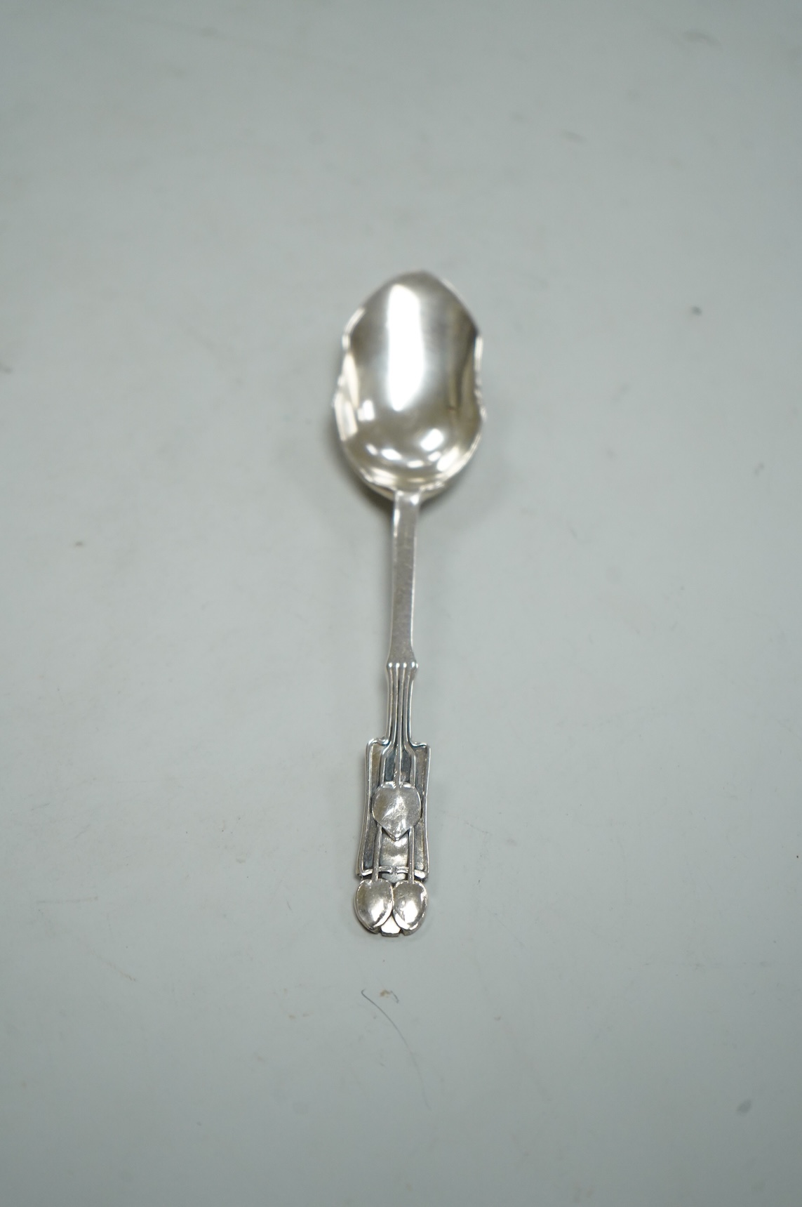 A George V Liberty and Co silver grapefruit spoon, designed by Archibald Knox, Birmingham, 1935, 12.4cm.